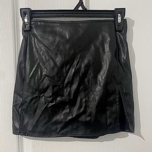 Leather mini skirt with a front slit from Fashion Nova
